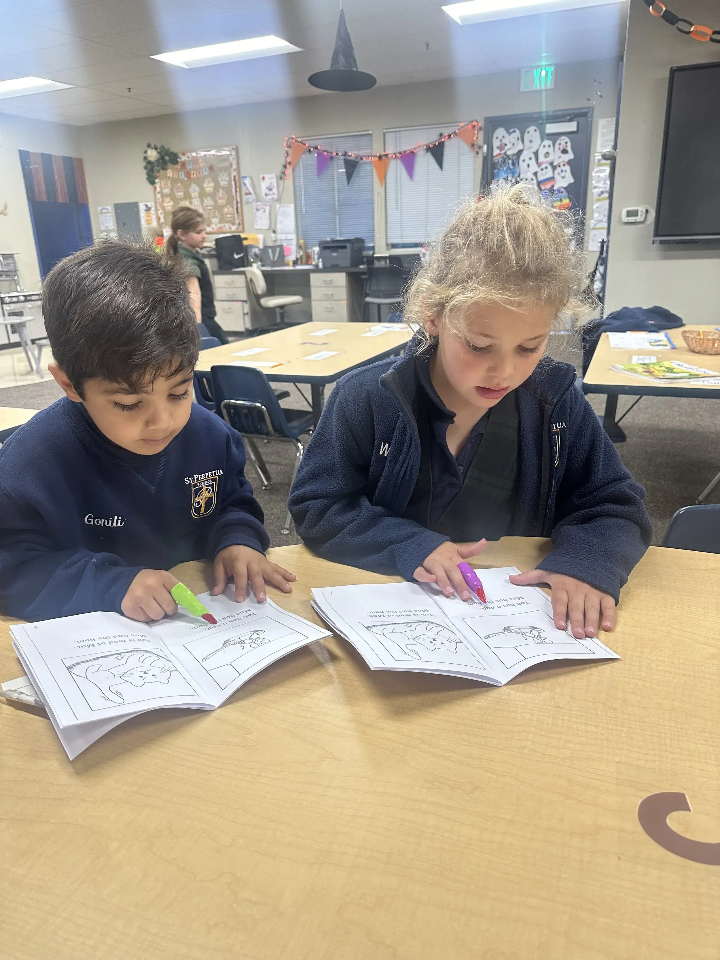 Young students learning in a warm kindergarten classroom at St. Perpetua